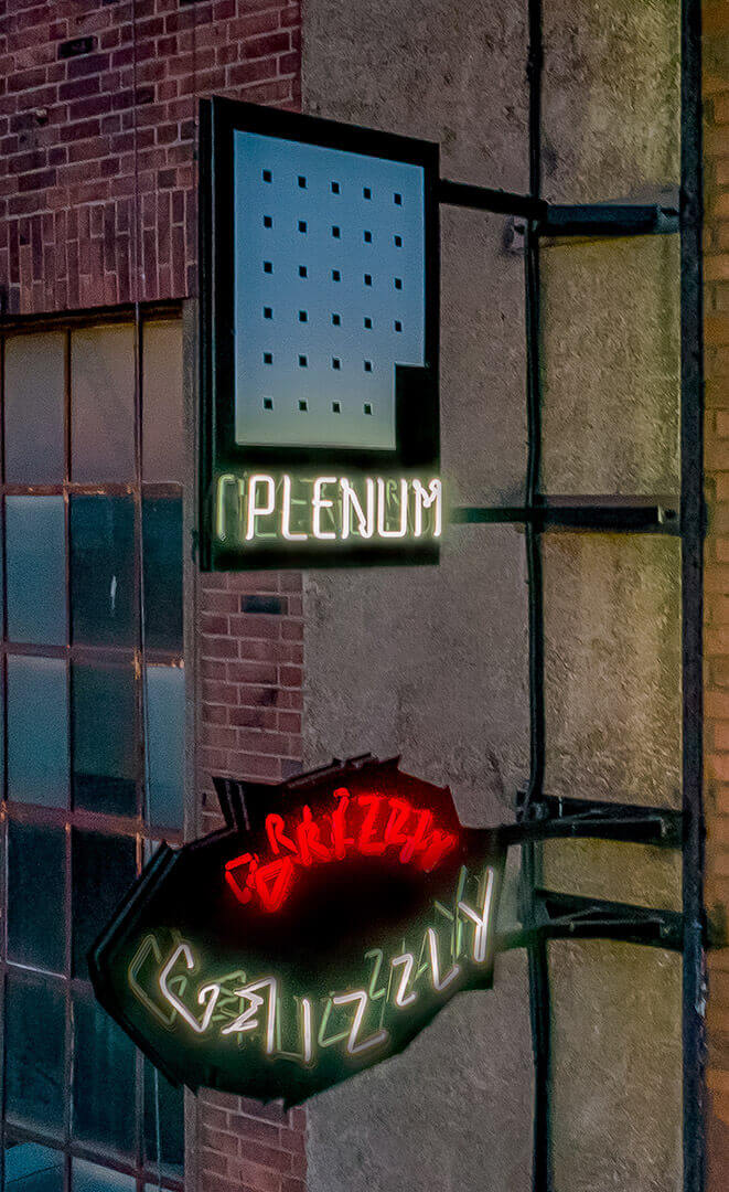 So Salsa_neon signs_with_neon_lights_at_night_mounted_into_the_building_from_outside_semafor_neon